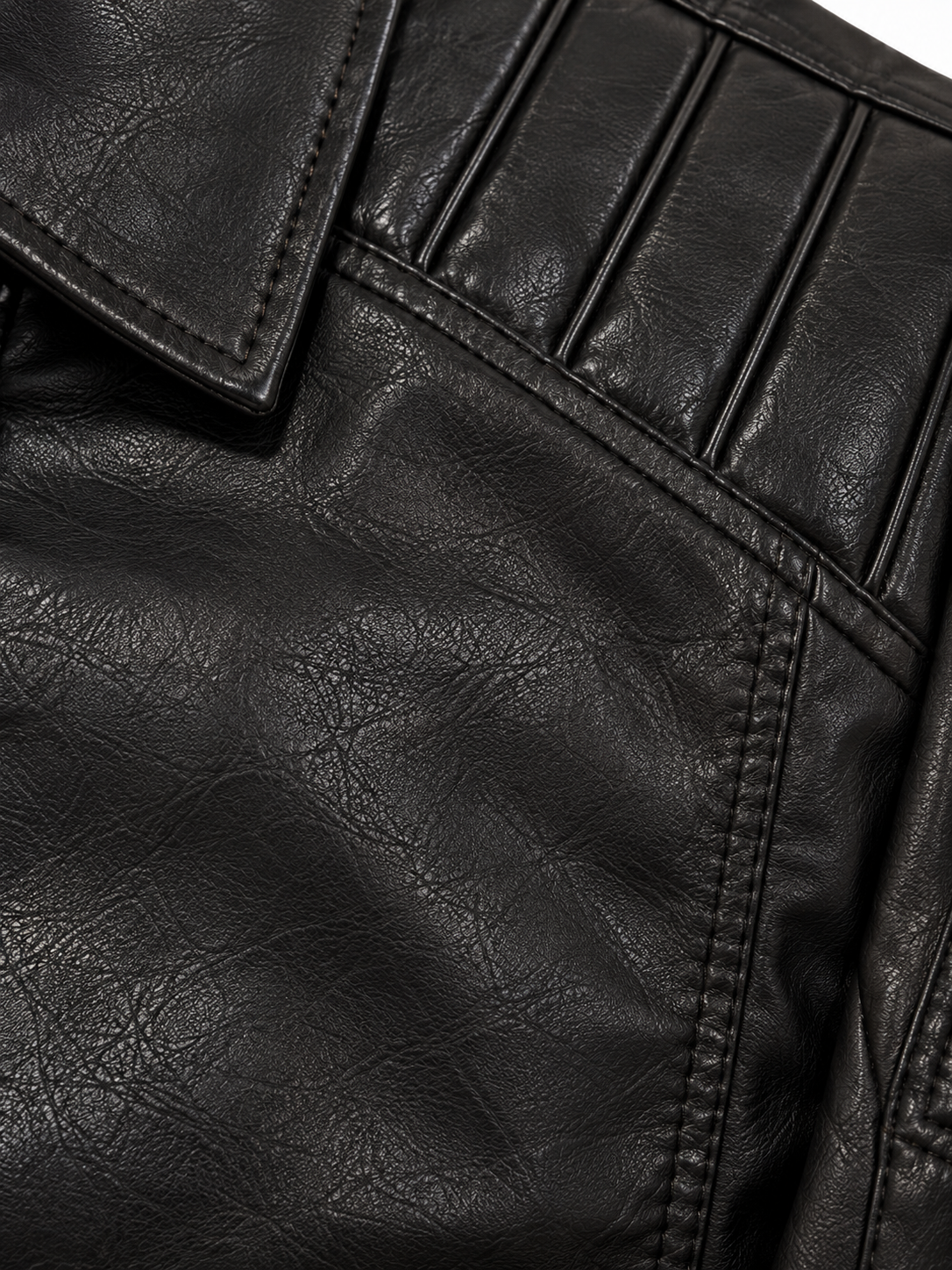 close up black leather stitching close up black leather stitching
